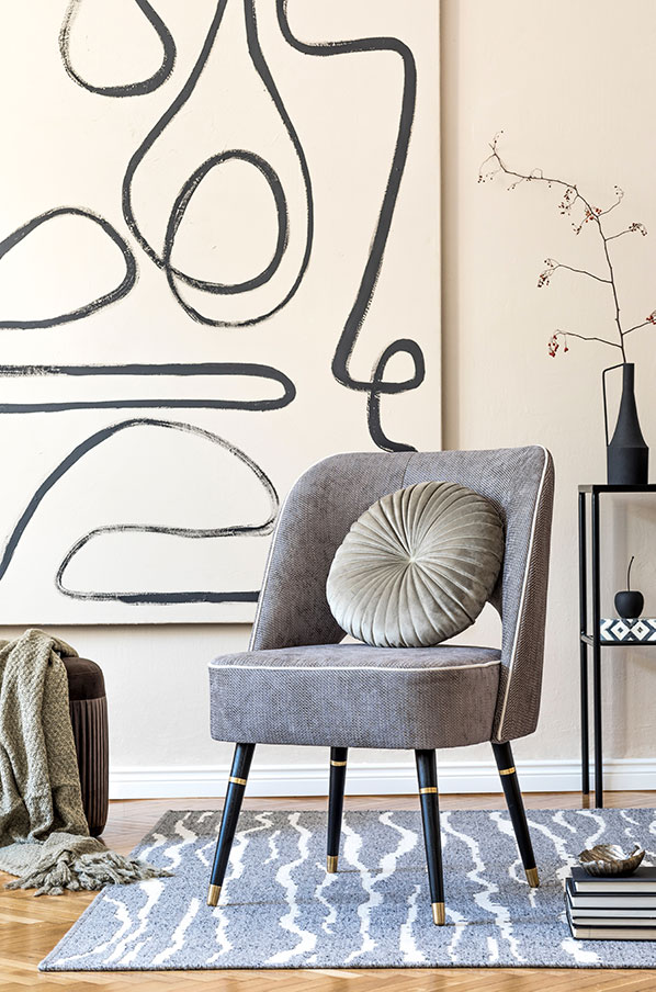 Mid-century chair against a hand-drawn line painting